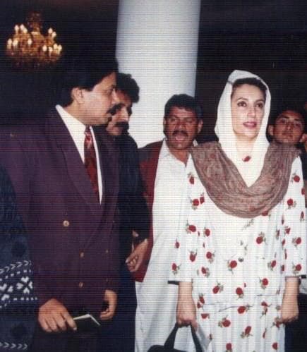With Benazir Bhutto at formal event